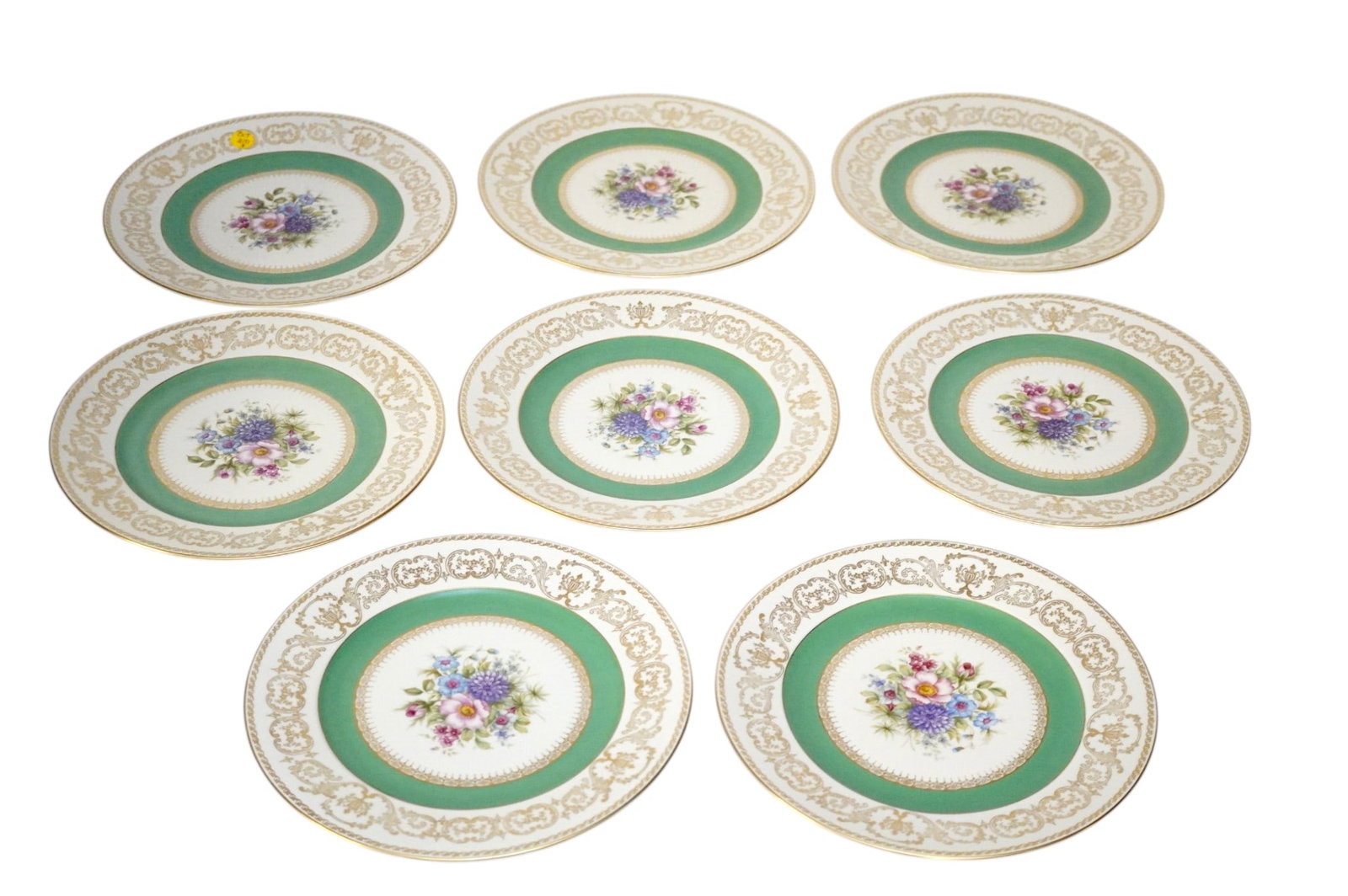 8 ROSENTHAL CONTINENTAL IVORY DINNER PLATES: 8 Rosenthal Continental Ivory Dinner Plates with central floral decoration and gilt borders Each measures 11"x11". Weight 10 lbs 5 oz **In house shipping available on this lot** If you win this lot, p