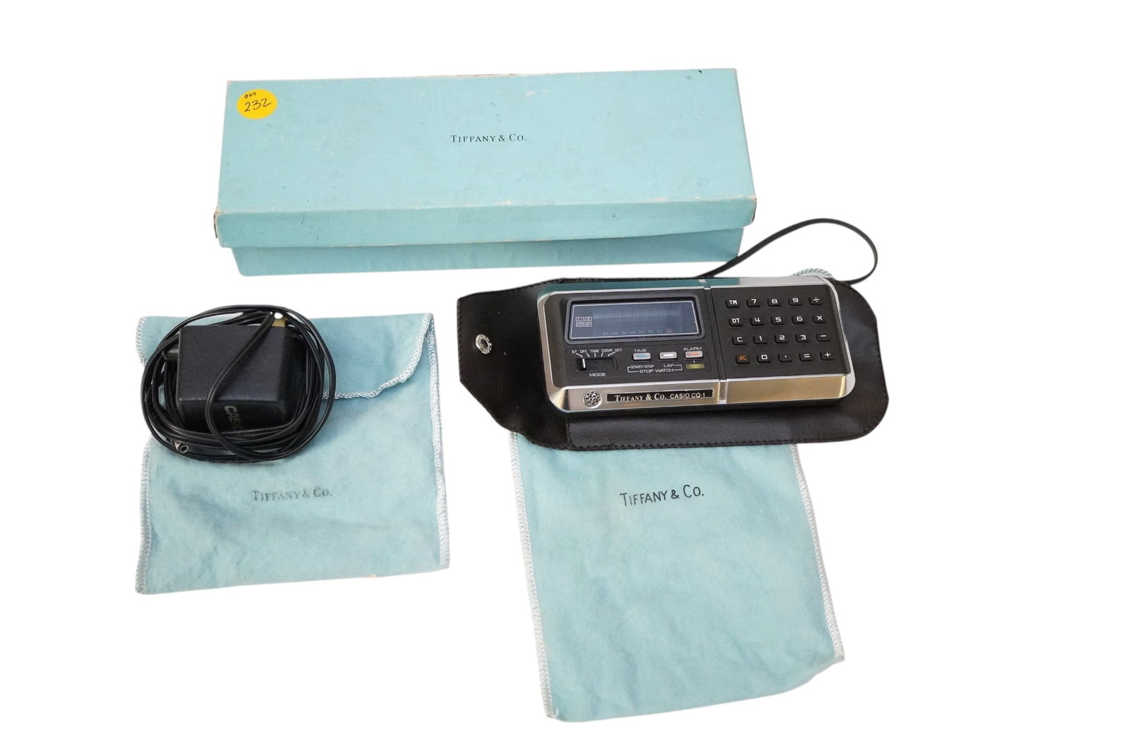 RARE TIFFANY AND CO. VINTAGE CASIO CQ-1 QUARTZ CALCULATOR CLOCK: Rare Tiffany and Co. Vintage Casio CQ-1 Quartz Calculator and Clock. With original box, paperwork, and plug. Total lot weight is 13.3 oz. and box measures 9 3/4" x 3.5" 2.5"