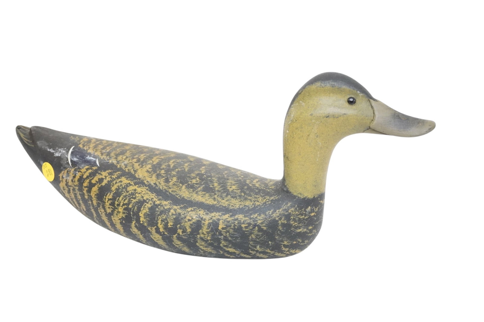 BLACK MALLARD DECOY PATRICK J GREGORY: Carved and Painted Black Mallard Decoy by Pat Gregory 1993. Measures 16 1/2"x4 3/4"x7". Weight 1 lb 11 oz Provenance: Gippy Plantation, Avenue of Oaks, Berkeley County, SC. **In house shipping availab