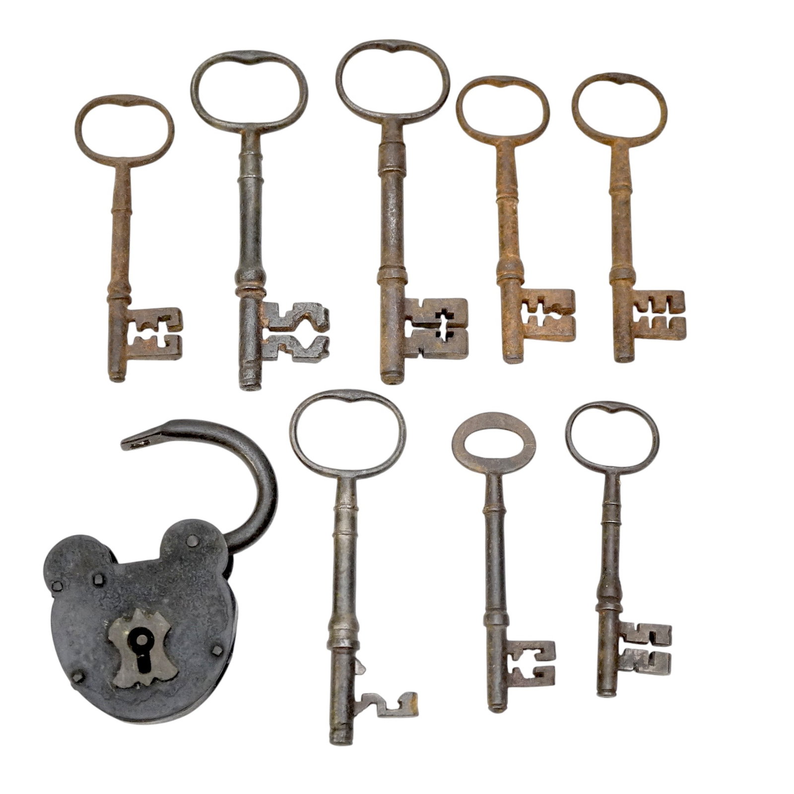 COLLECTION OF ANTIQUE SKELETON KEYS & PADLOCK 9 PC: Group of 8 antique skeleton keys and 1 padlock. Largest key measures 5.25" long. Approximate combined weight 1.5 lbs. **In house shipping available on this lot** If you win this lot, please select sel