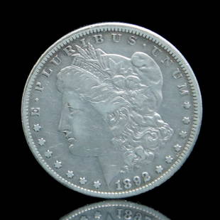 1892 CC Morgan Silver Dollar: Grade: Fine to Very Fine - Morgan dollars are the most widely collected U.S. silver coin. A classic design that is truck in 90% fine silver. This 1892 CC was minted at the Carson City Mint which