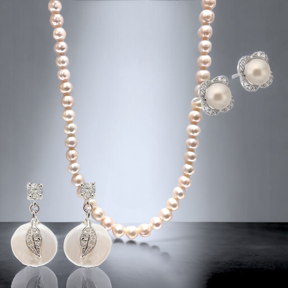 Pearl Radiance Sterling Silver Jewelry Set: Embrace the timeless elegance of this stunning jewelry set. Crafted in sterling silver, the earrings feature lustrous freshwater pearls complemented by delicate white cubic zirconia, creating an exqui