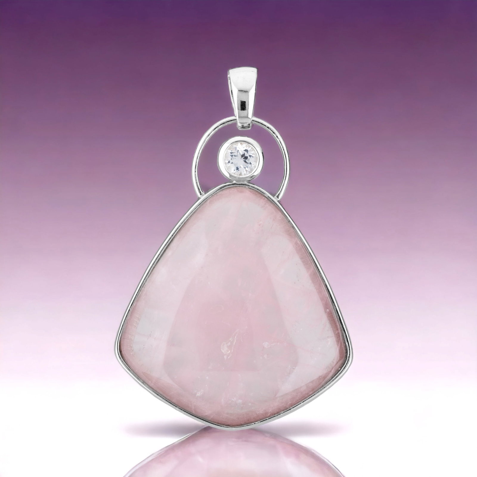 Rose Quartz Pendant with White Topaz Accents: This stunning pendant showcases a captivating rose quartz gemstone, exuding a soft and romantic hue. The graceful pink tones of the rose quartz are accentuated by the brilliance of white topaz, adding