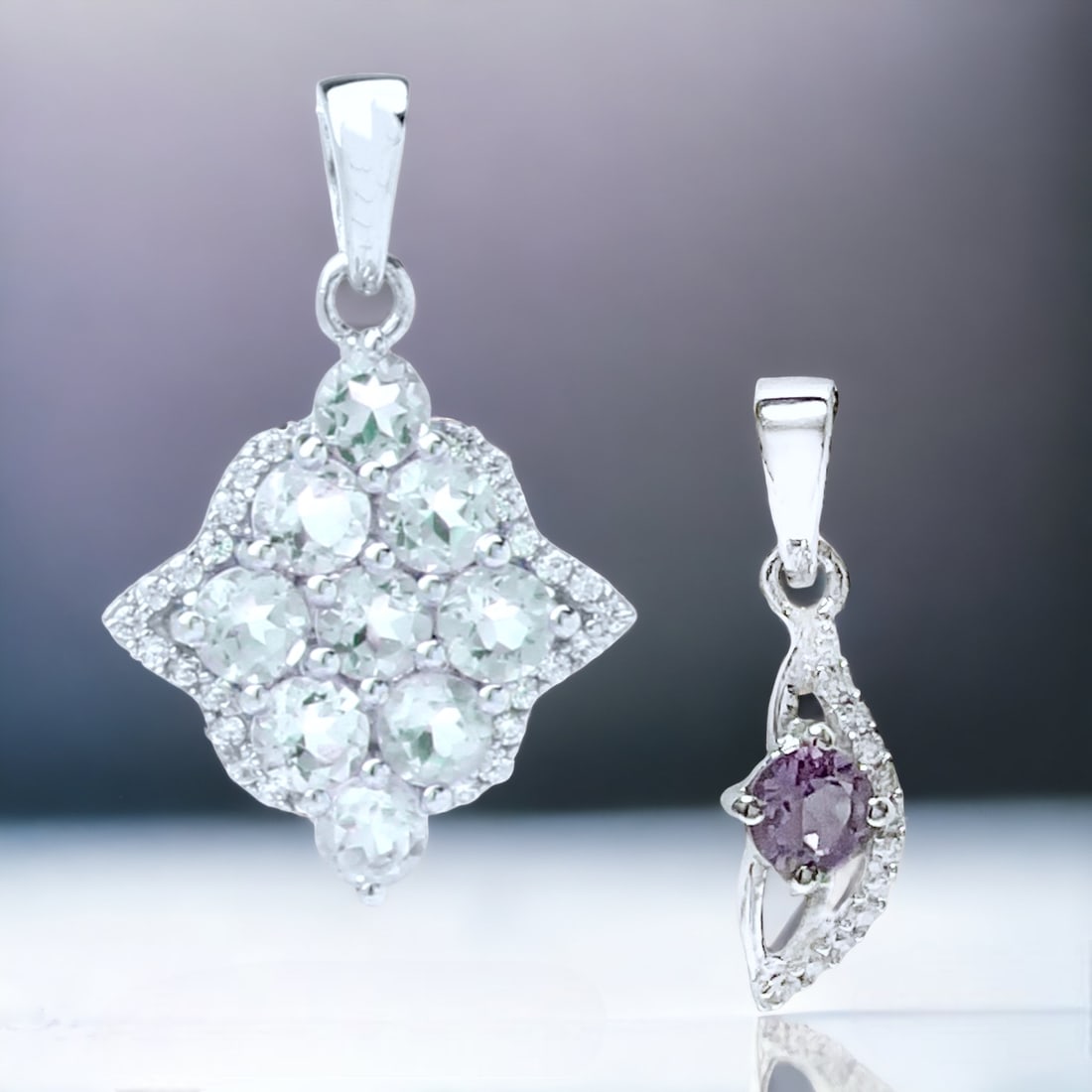 Radiant Amethyst Sterling Silver Pendant Duo: Embrace the enchanting allure of amethyst with this exquisite pendant duo. The first features a captivating green amethyst complemented by glistening white zircons, while the second showcases a rich A