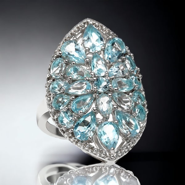 Sky Brilliance: Blue Topaz Silver Ring: Crafted in sterling silver, this size 5 ring boasts a captivating sky blue topaz, radiating with brilliance and charm reminiscent of clear azure skies. The exquisite design and vibrant gemstone make t