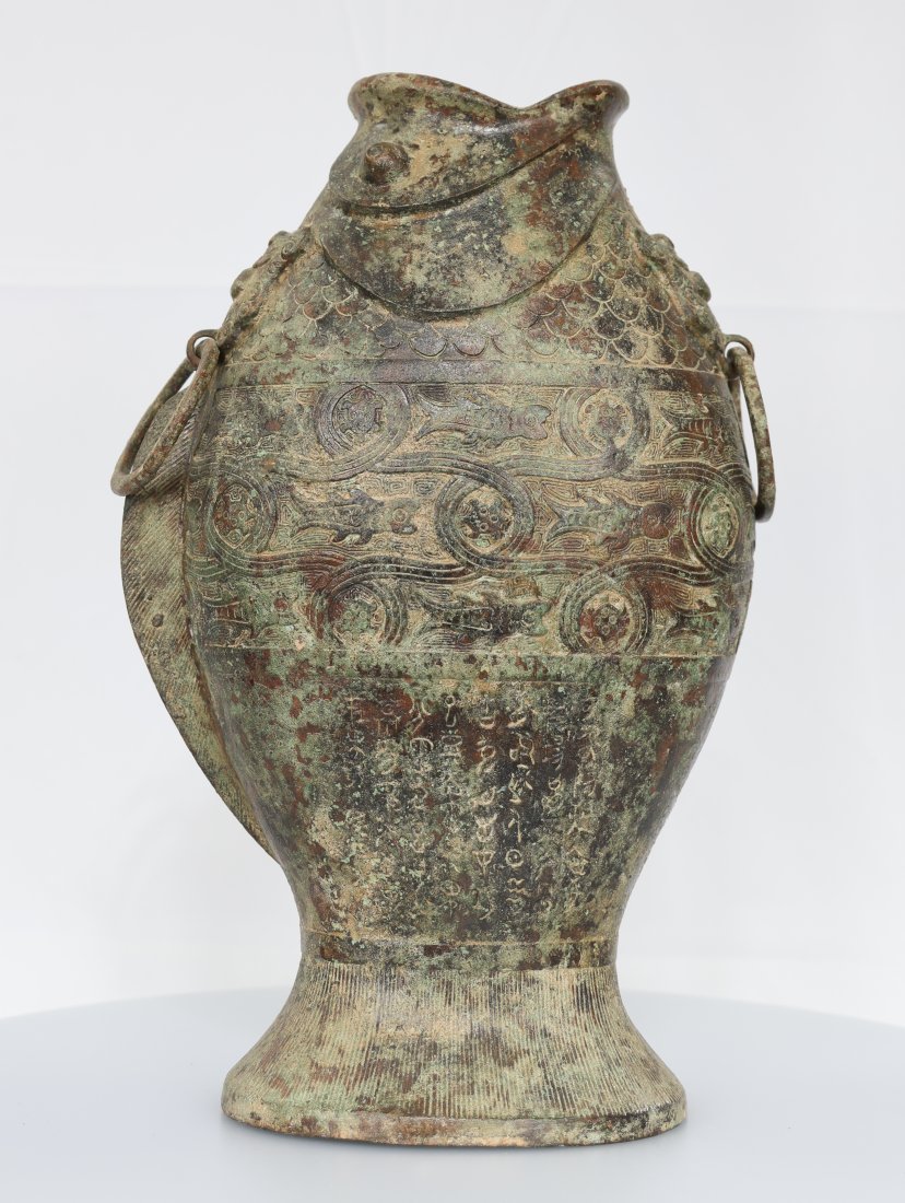 Bronze Ware Fish Zun inscription Bottle Vase vessel: A Bronze ware fish Zun inscription bottle vase vessel is an extraordinary and historically significant artifact that showcases the artistry, cultural heritage, and craftsmanship of ancient Chinese dyn