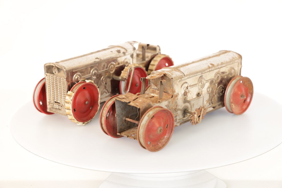 Louis Marx & Company Vintage Tinplate Tractors – Pair of Early 20th Century Collectibles: Step back in time with this charming pair of vintage tinplate tractors, dating back to the early 20th century. These nostalgic toys are a delightful addition to any antique collection or vintage toy d