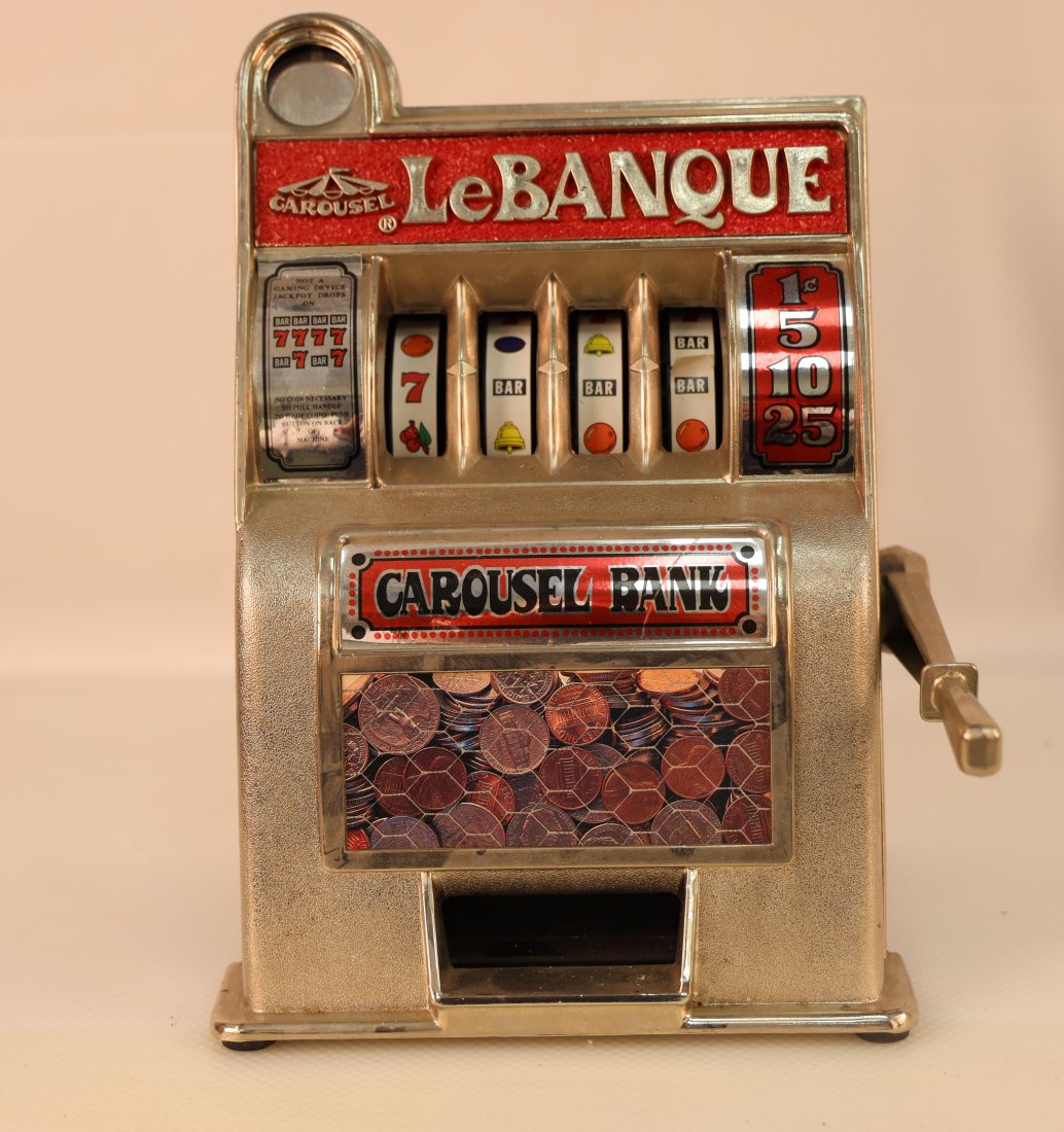 Vintage Carousel Bank Slot Machine Coin Bank - LeBanque: Step back in time with this charming vintage Carousel Bank Slot Machine Coin Bank, branded as "LeBanque." This delightful piece captures the essence of classic slot machines with its nostalgic design 