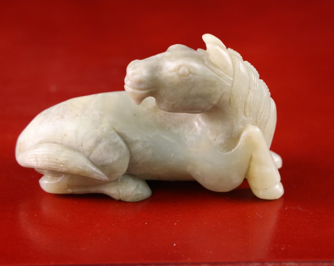 Exquisite Antique Chinese Jade Horse Figurine: Presenting a finely crafted antique Chinese jade figurine depicting a reclining horse, symbolizing strength, grace, and tranquility. This exquisite piece showcases the skilled craftsmanship of ancient