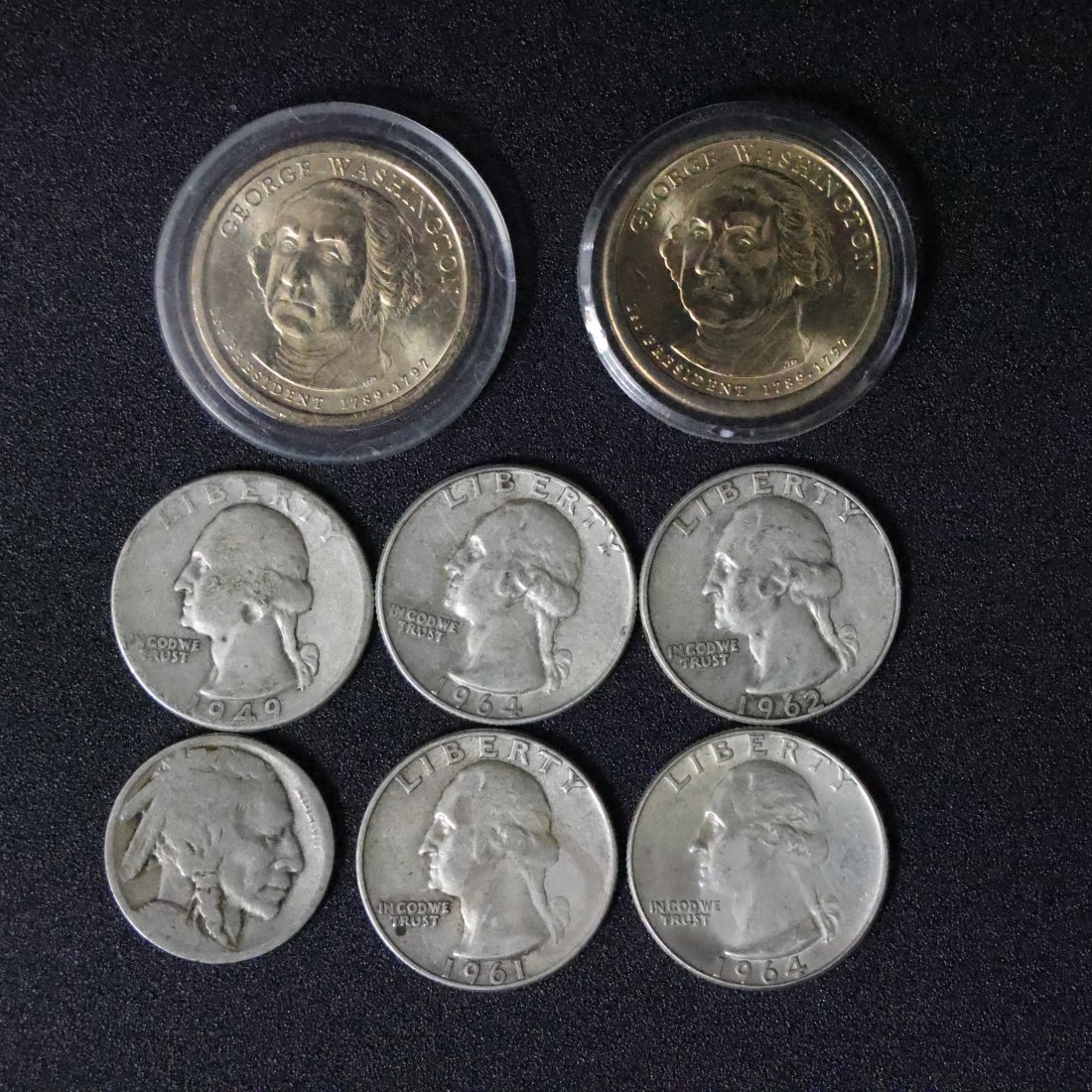 Diverse Mix of U.S. Collectible Coins: Silver Quarters and Modern Commemorative Dollar: Enhance your coin collection with this varied assortment of U.S. coins, featuring both historical silver quarters and a modern commemorative silver dollar. This set provides a blend of traditional and