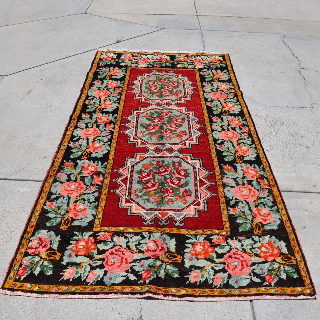 Vintage Hand-Knotted Floral Persian Rug - Bold Floral Design - 9.1*4.10 FT: Enhance your space with the vibrant charm of this vintage hand-knotted Persian rug. Showcasing a bold floral design, this rug features a rich red field with three central medallions, each adorned with