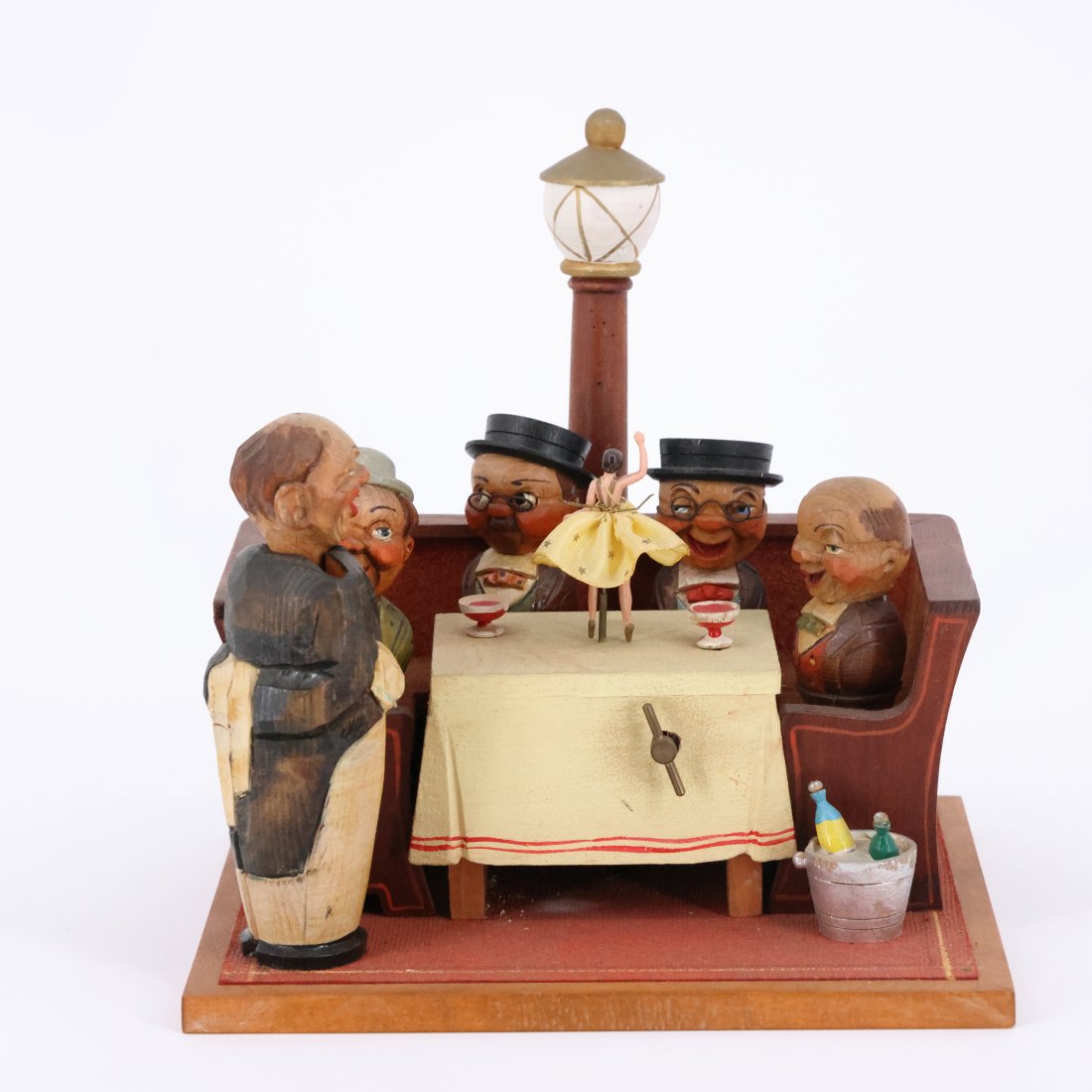 Germany Charming Vintage Anri Hand-Carved Wooden Music Box - 40th Anniversary Edition (1912-1952): Step back in time with this delightful vintage Anri hand-carved wooden music box, commemorating Anri's 40th anniversary (1912-1952). This exquisite piece features a whimsical scene of jovial gentlemen
