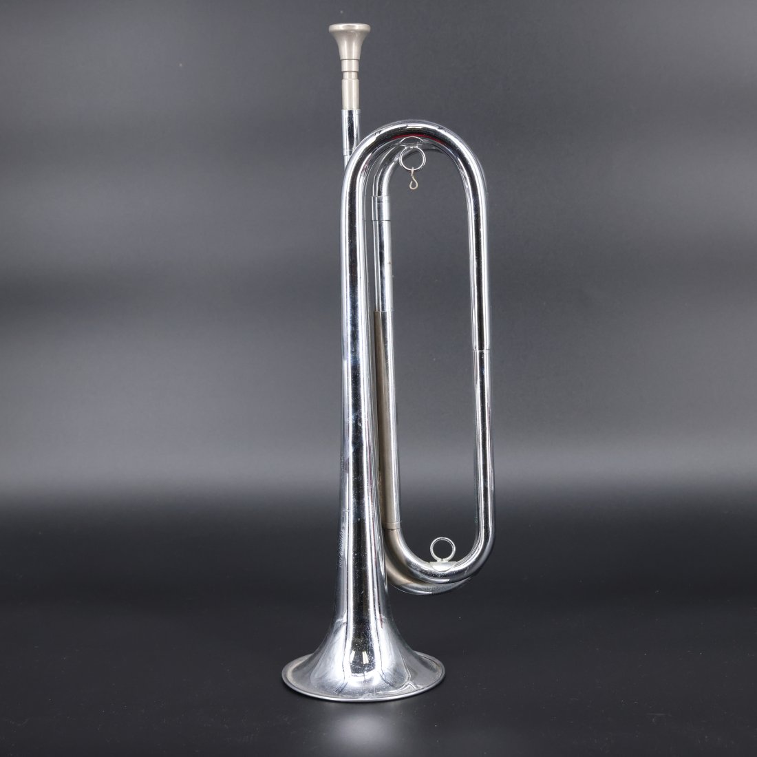 Vintage Boy Scouts of America Official Rexcraft Bugle: Capture the spirit of scouting with this vintage Boy Scouts of America Official Rexcraft Bugle. This beautifully crafted instrument, with its gleaming silver finish, stands as a symbol of tradition an