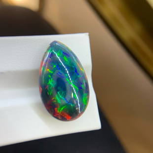 CERTIFIED 17.8 CT NATURAL COLOR OPAL LOOSE STONE: Ref:708328 Gold Content:14K Gold Main Gemstone:Opal Number of stones:1 Shape:Pear Carat Weight:17.8ct Color:Color Treatment:Natural Cut Grade:G