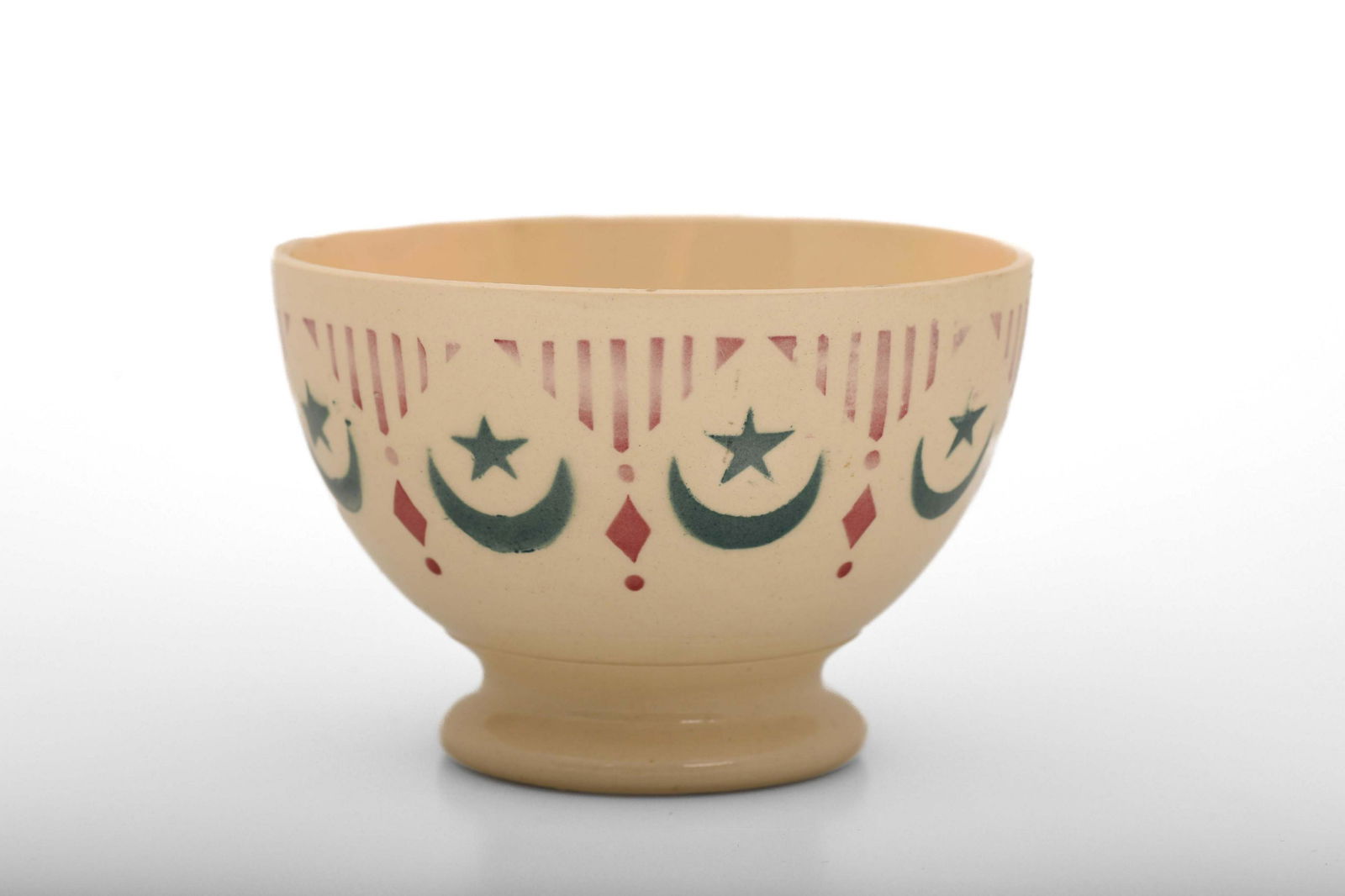 OTTOMAN-ISLAMIC "FRENCH SARREGUEMINES DIGION BOWL": Very lovely and rare antique French cafe au lait bowl, small size, light beige base, red and green stenciled decoration depicting an islamic pattern in orientalist style, this kind of tableware was pr