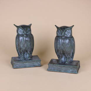 Arts & Crafts Pottery Owl Bookends: Pair, Arts & crafts pottery owl bookends with matte green under gray glaze. Each marked with spurious oval Fulper ink stamp on original felted bottom. Circa 1920s. 6.75" x 4.75" x 3". This lot