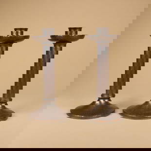 Roycroft Hammered Copper Candlesticks: Pair, Roycroft hammered copper candlesticks with cylindrical shafts, model 406. Each marked with small early impressed orb and cross. East Aurora, NY. Circa 1920. 6.5” x 3.25”. This lot