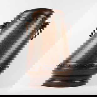 Large 2-Handled Copper Floor Vase: Large reverse-tapered hammered copper two-handled floor vase with riveted construction. Attributed to Stickley Brothers by Cincinnati Arts Galleries in their "Rookwood X & Keramics 2000" auction