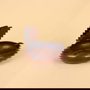 Dirk Van Erp Copper Ashtray: Dirk van Erp hammered copper ashtray with riveted matchbox holder. Signed with impressed windmill mark. San Francisco, CA. Circa 1910. 5.25” x 3.25”. This lot ships from our