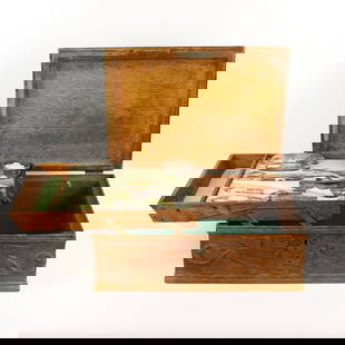 Carved Oak Fitted Box with Gorham Vanity Set: Large carved quartersawn oak box fitted with a Gorham sterling silver vanity, or grooming set. Box is dated 1902 on the back panel, and beautifully decorated with hand carved winged lions, griffin