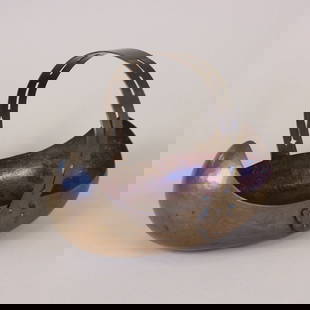 Dirk Van Erp Hammered Copper Flower Basket: Dirk van Erp hammered copper flower basket, or bowl, with riveted cutout handle. Impressed open-box windmill mark. San Francisco, CA. Circa 1910. 10.5" x 8" x 8” tall. This lot ships from our