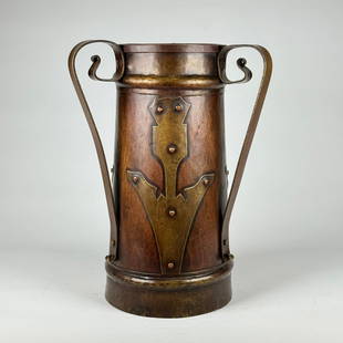 Stickley Brothers 3-Handled Russian Vase: Russian three-handled hammered copper and brass vase with applied stylized flower motifs. This form was imported and retailed by Stickley Brothers in Grand Rapids, MI, and appears on numerous pages of