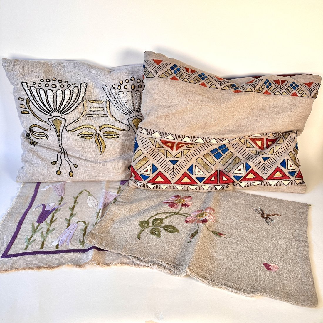 Arts & Crafts Group of Embroidered Pillows: Group of four pillows, two finished and filled. Geometric pillow measures 19" by 14". This lot ships from our California location.