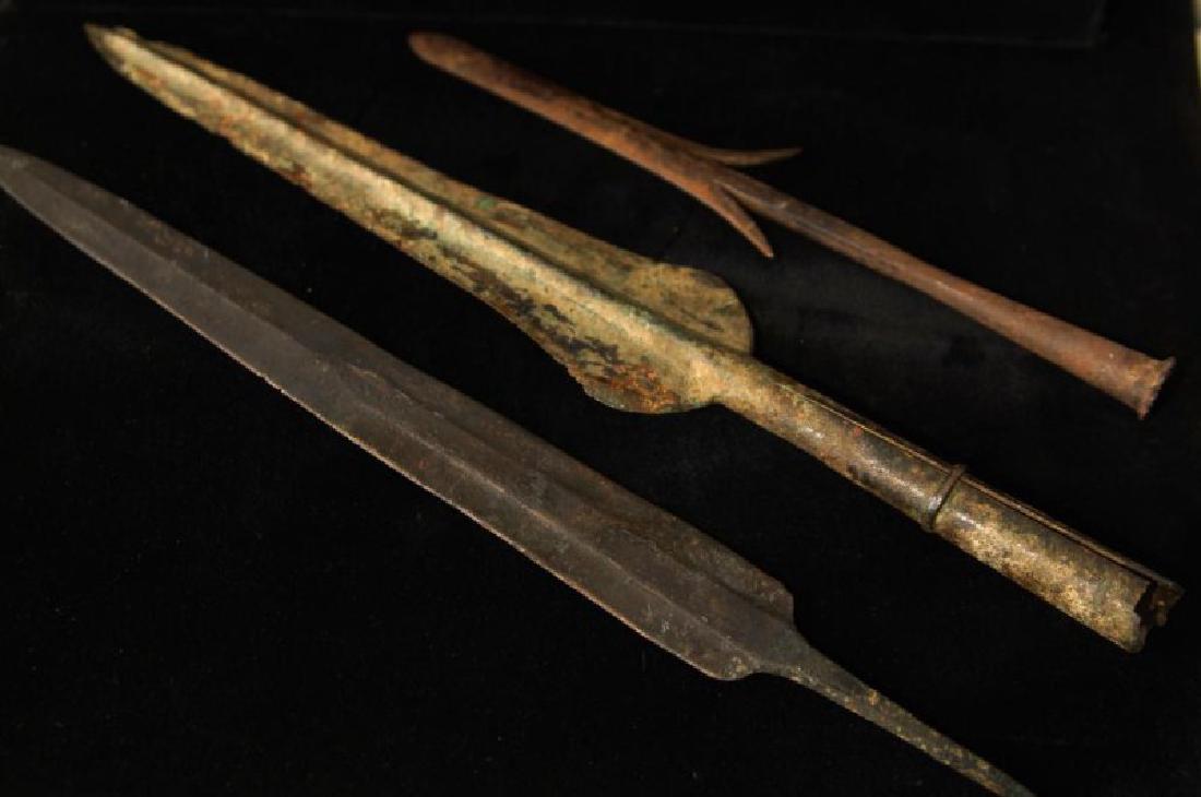 3 Spear Heads from Antiquity: Two bronze spear heads, both measure 13" the iron one measures 9". Show heavy oxidation, nice green patina, evidence that it has been used and sharpened. The iron point shows use of age and sharpening
