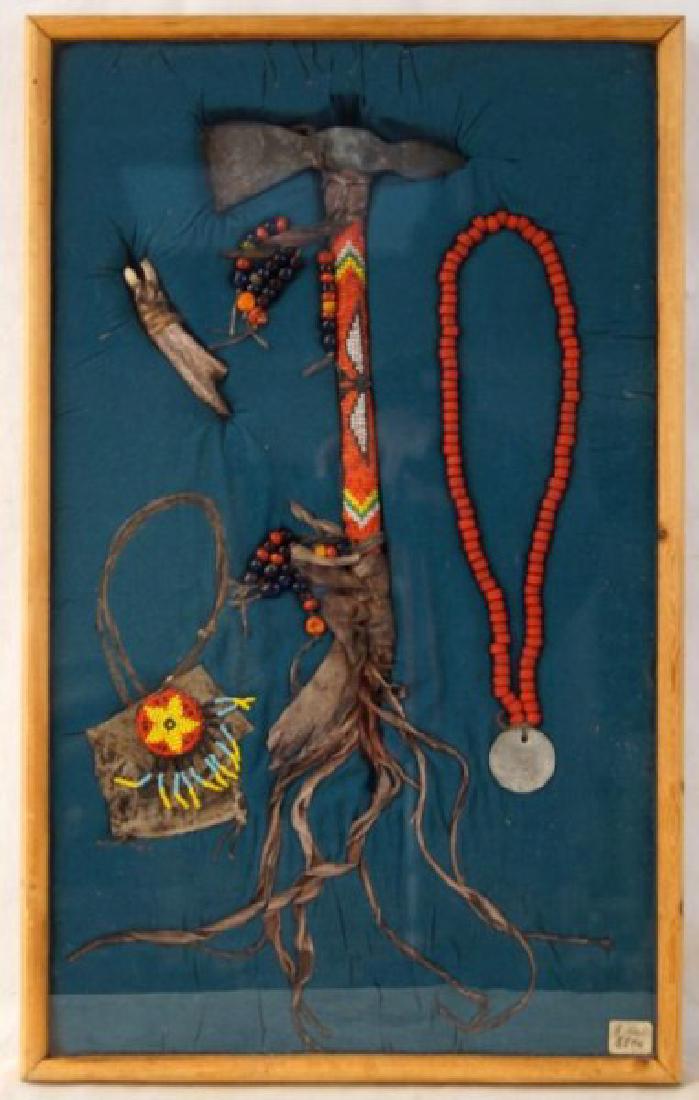 Yakima Nation beaded Tomahawk presentation: An Old Indian Iron tomahawk with a beaded wood handle laced with leather and trade beads. A coral beaded necklace with a Confederated Tribes and Bands Yakima Nation 1855 Treatise coin medallion, and a