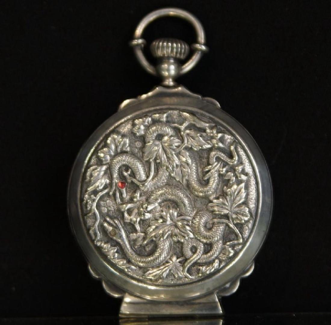 Rare prohibition Chinese silver hidden jigger: Jigger hidden inside a watch case - embossed with vines and snakes