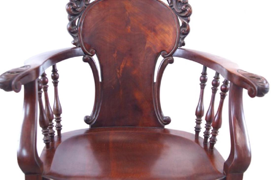 American Mahogany antique claw foot arm chair: 19th c. Antique - nicely carved claw feet, and a double griffin facing a central orb on the back splat.