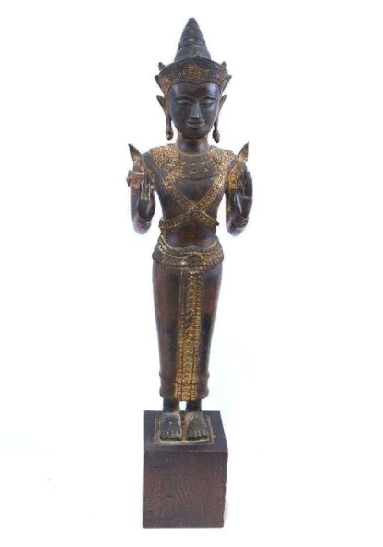 Antique Thai bronze Buddha: Remnants of Gold throughout, Bronze, showing the double up hands (Peace), bronze measures 23.9" H, 29" when standing on the wood carved pedestal. Both Show Age