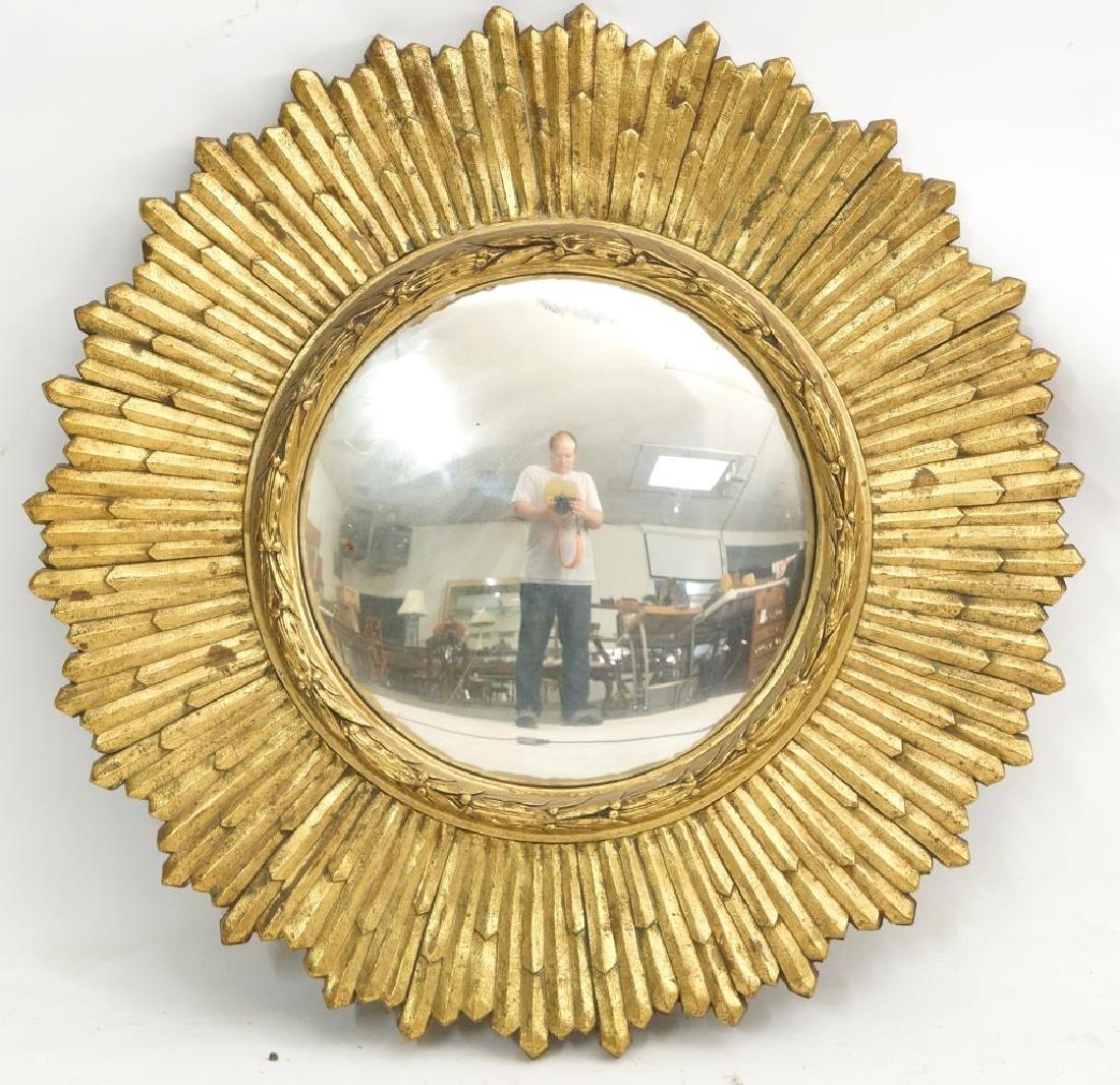 A Period Sunburst convex glass Mirror: Convex (Bulls Eye) mirror surrounded by a gilt painted wood frame, included a small wreath around the glass and the sunburst form