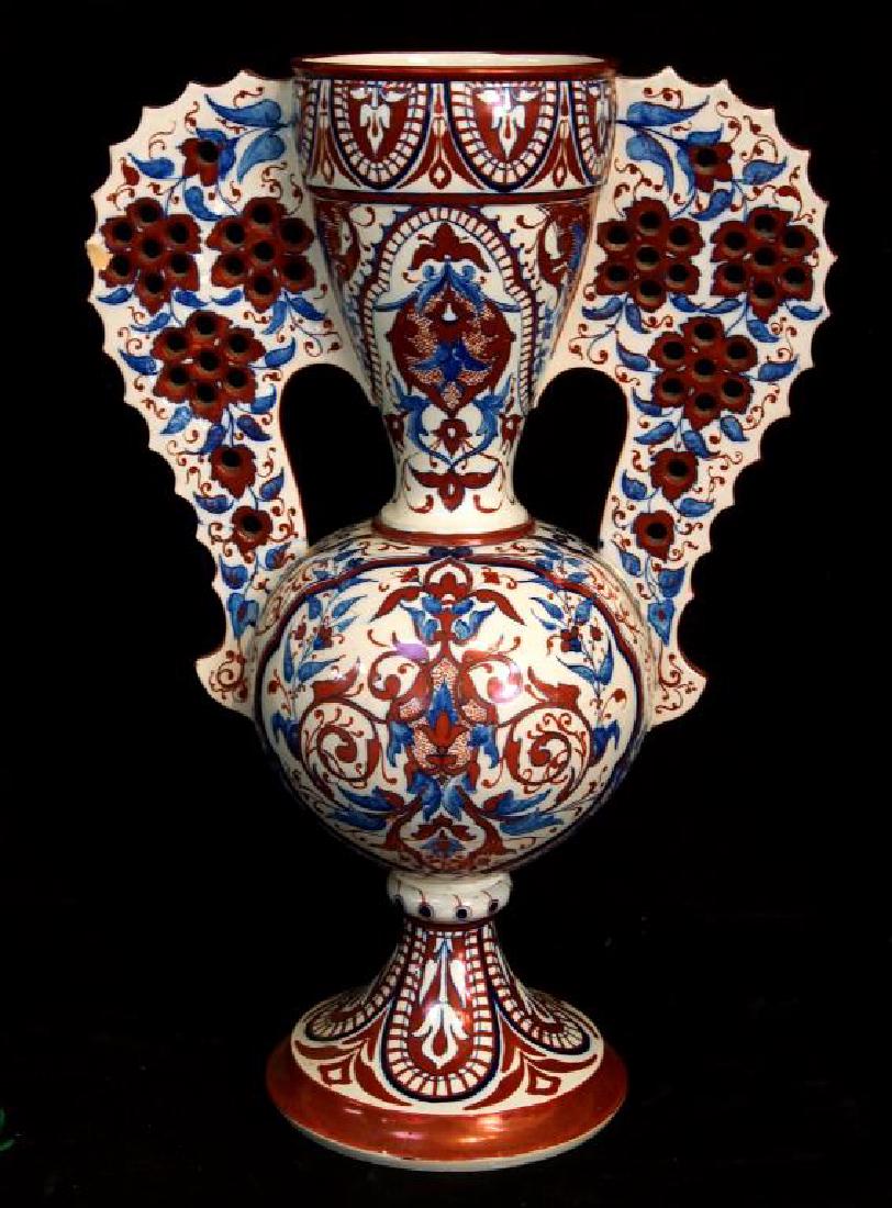Richard Ginori Lusterware grand vase: elaborate rose handles, with pierced pints on every pedal. Richard Ginori earthenware vase measures 20" H
