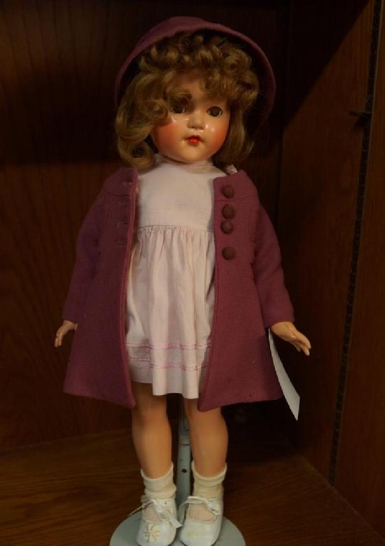 Vintage Effanbee composition doll w/ purple coat: measures 21" H with bonnet overcoat and vintage dress