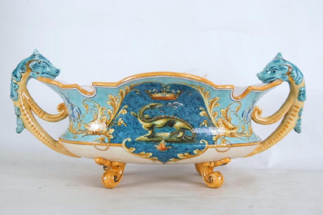 Ulysse Blois Ceramic Faience center piece: Ulysse Bloise 1862-1952 signed Faience footed center bowl signed by E. Balon featuring a handpainted central dragon and two magnificent dragon handles measures 15.5" x 9" x 5.5" H