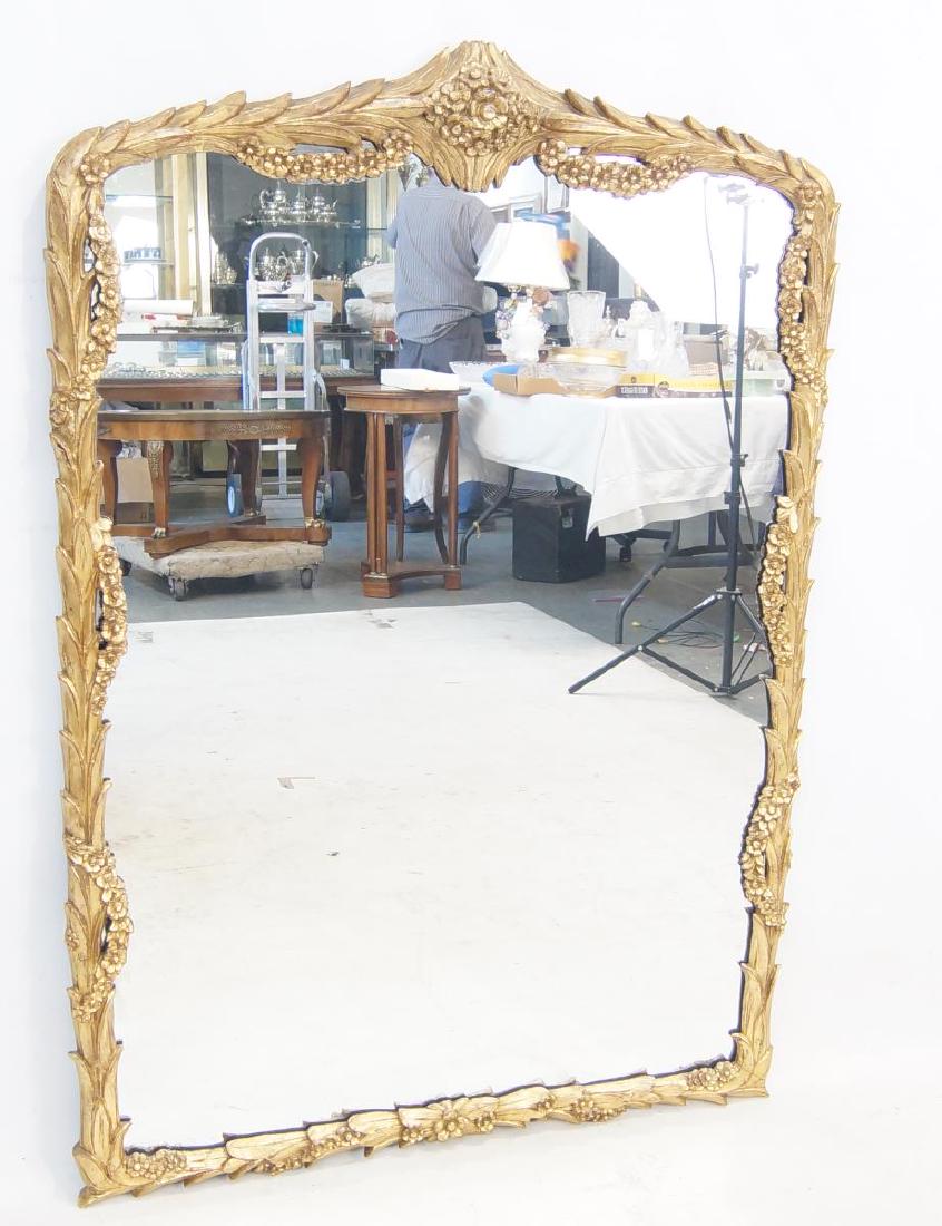 Antique French Gilt wood mirror: shows age, finely carved featuring an all around wreath design measures 51" x 34"