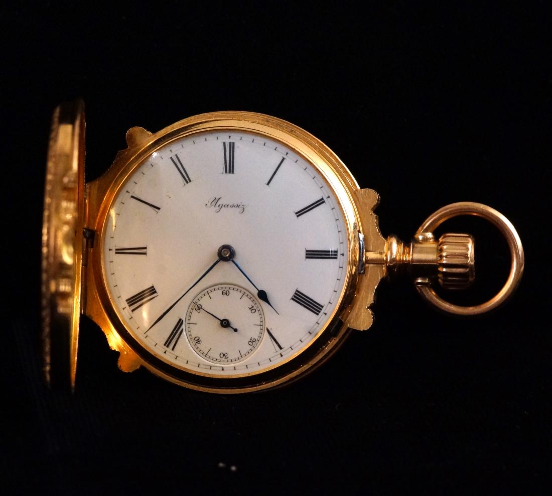 Agassiz, Switzerland 18kt Rose Gold Pocket Watch: A Very fine Antique Agassiz Watch Co. Very fine Switzerland Agassiz pocket watch in a 'True Box' 18kt rose gold engraved case, measures 64 x 42 mm total weight 84.8 grams