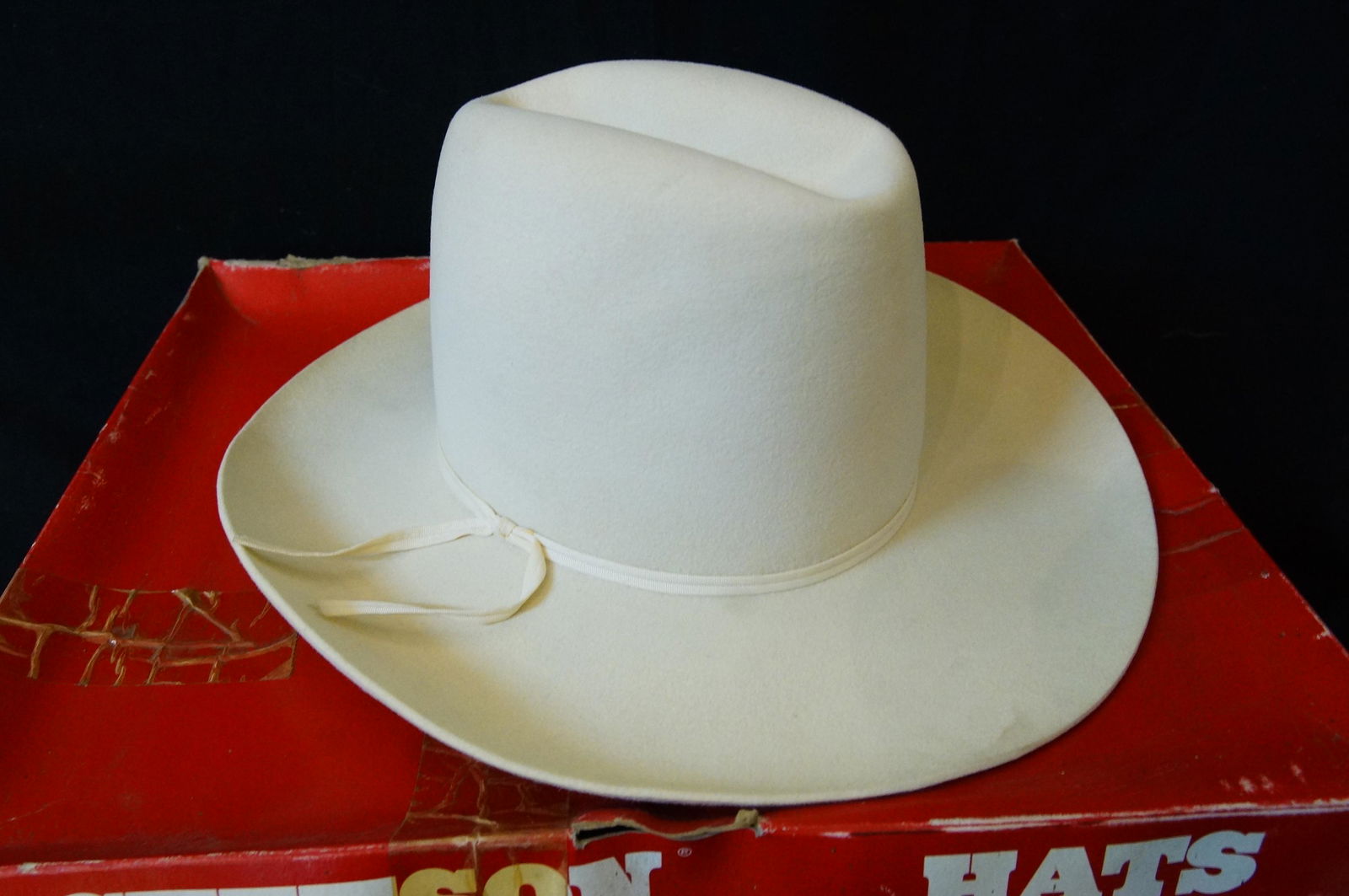 Near Mint Stetson hat in original box: XXXXX Stetson, Off white beaver?, with white hat band. Someone has to play the hero. 7 1/8" in original Stetson box Provenance: American rodeo rider John Martin Los Feliz, Calif. -