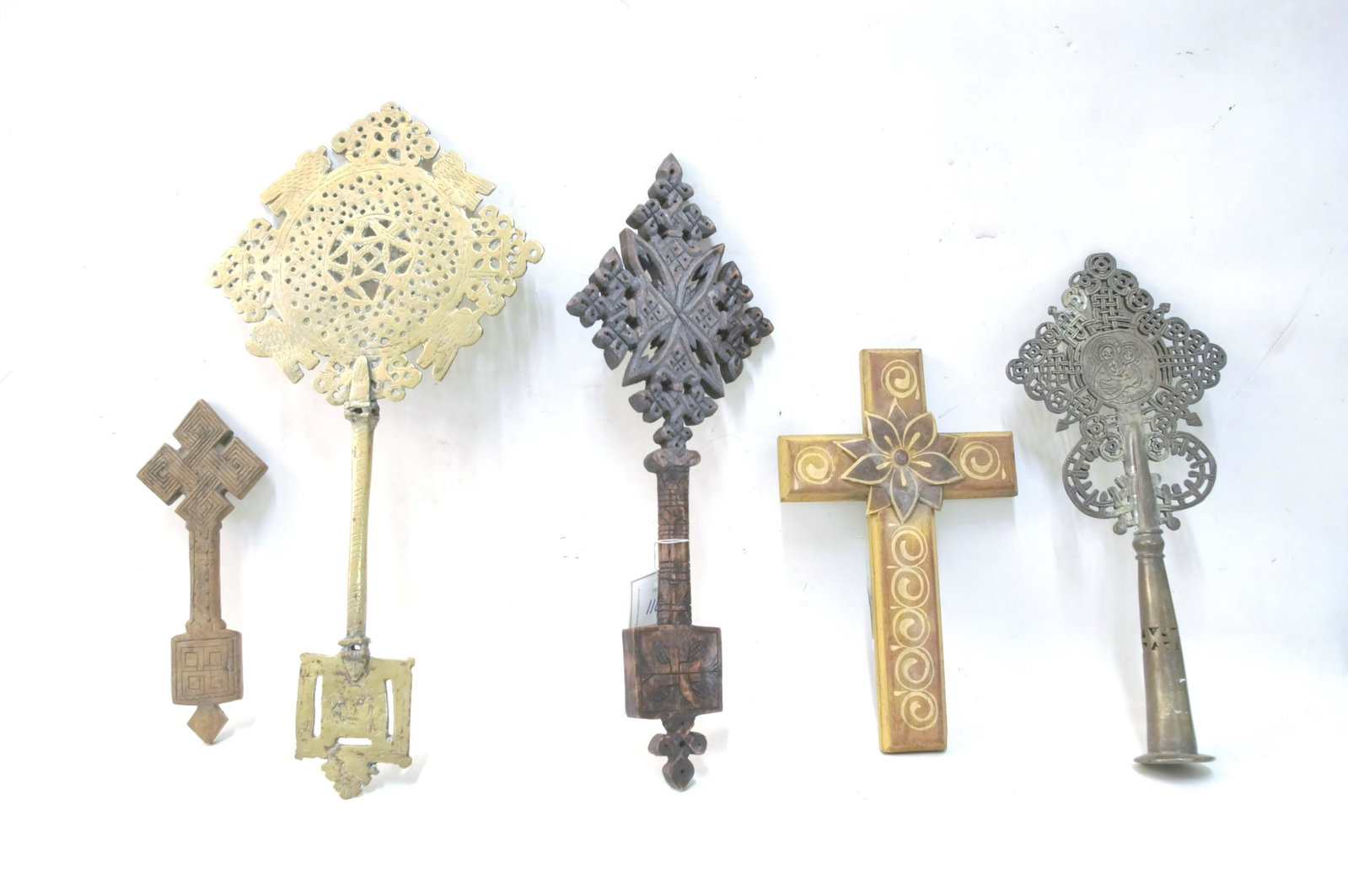 Collection of Six Antique and Vintage Crosses: Featuring four Ethiopian Coptic crosses two brass Bishop crosses, two carved wood, a very nicely carved hand cross with the Christ and Mary on the other side made in Kiev, Russia, and a South American