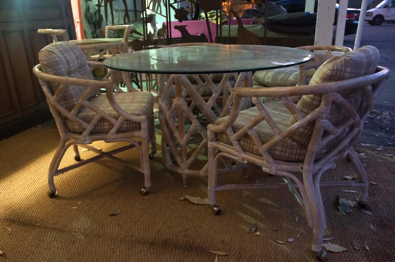 Rattan dining set 7 ps. set: matching 7pc set - four chairs on wheels, glass top pedestal table, glass top tray, and stool
