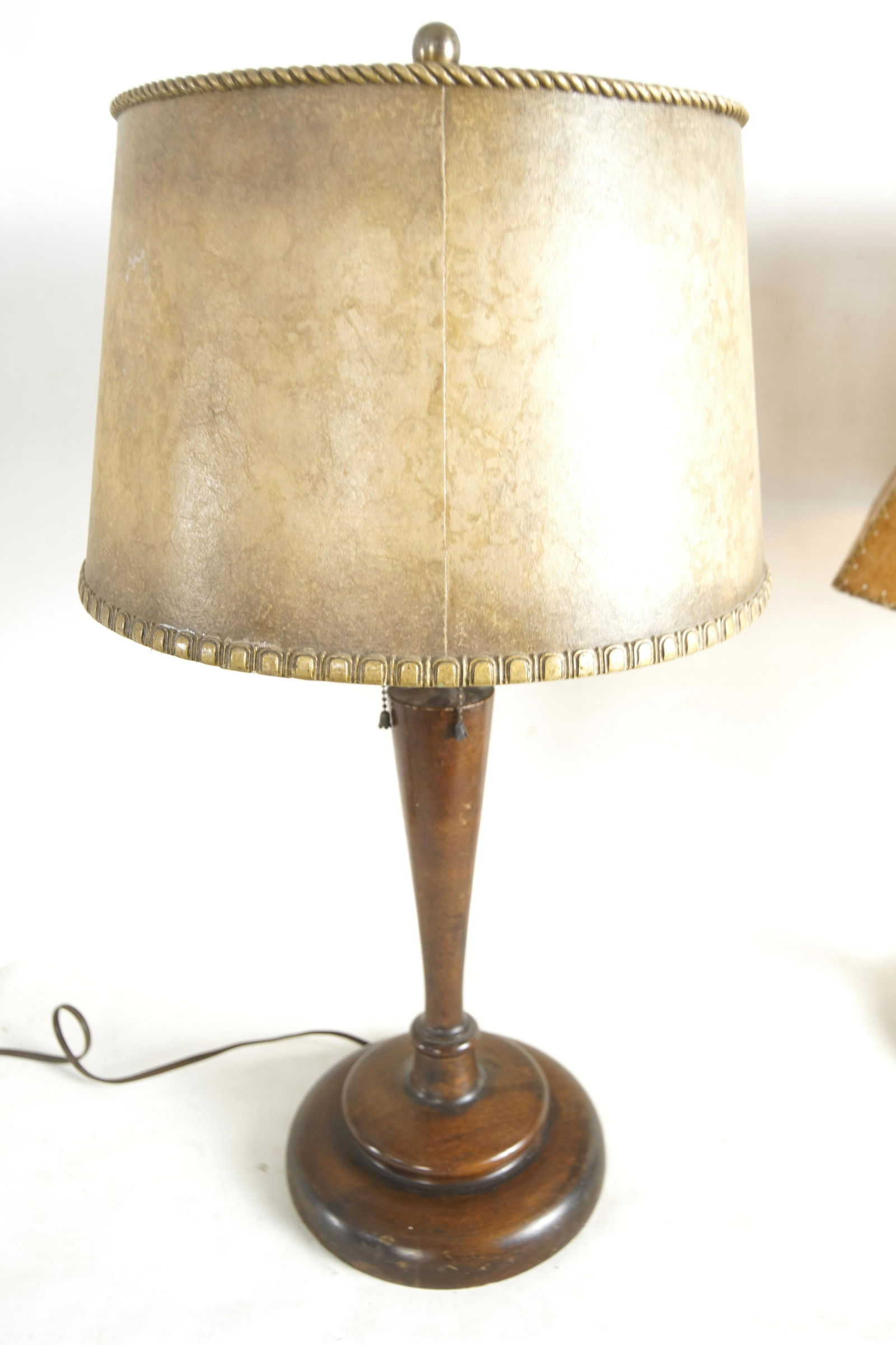 Antique Wood table lamp with mica shade: 29" high one piece wood carved table lamp with vintage pulls and a very old polychrome painted mica shade with applied gold borders Provenance: The Rancho La Vista Ojai California Collection