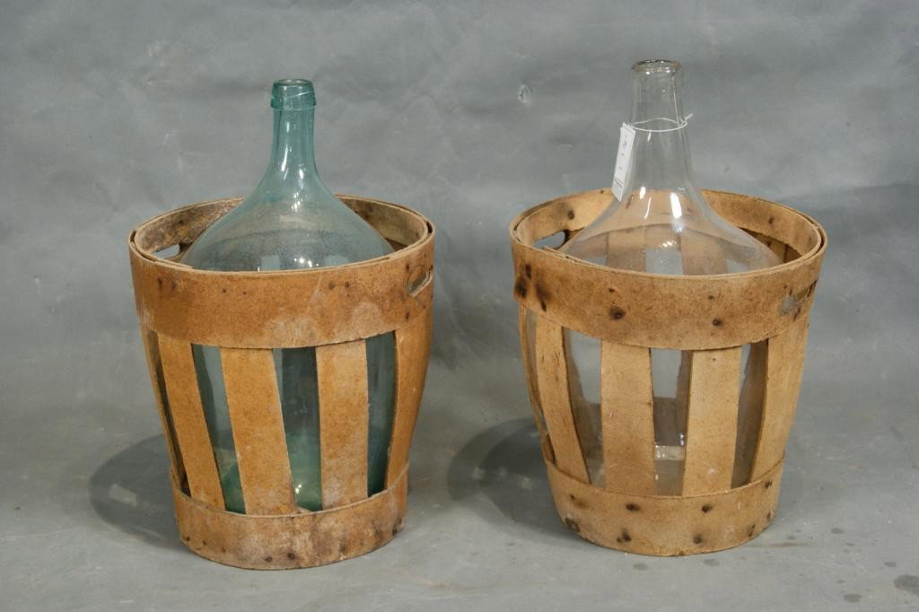Antique large wine bottles in crates 2