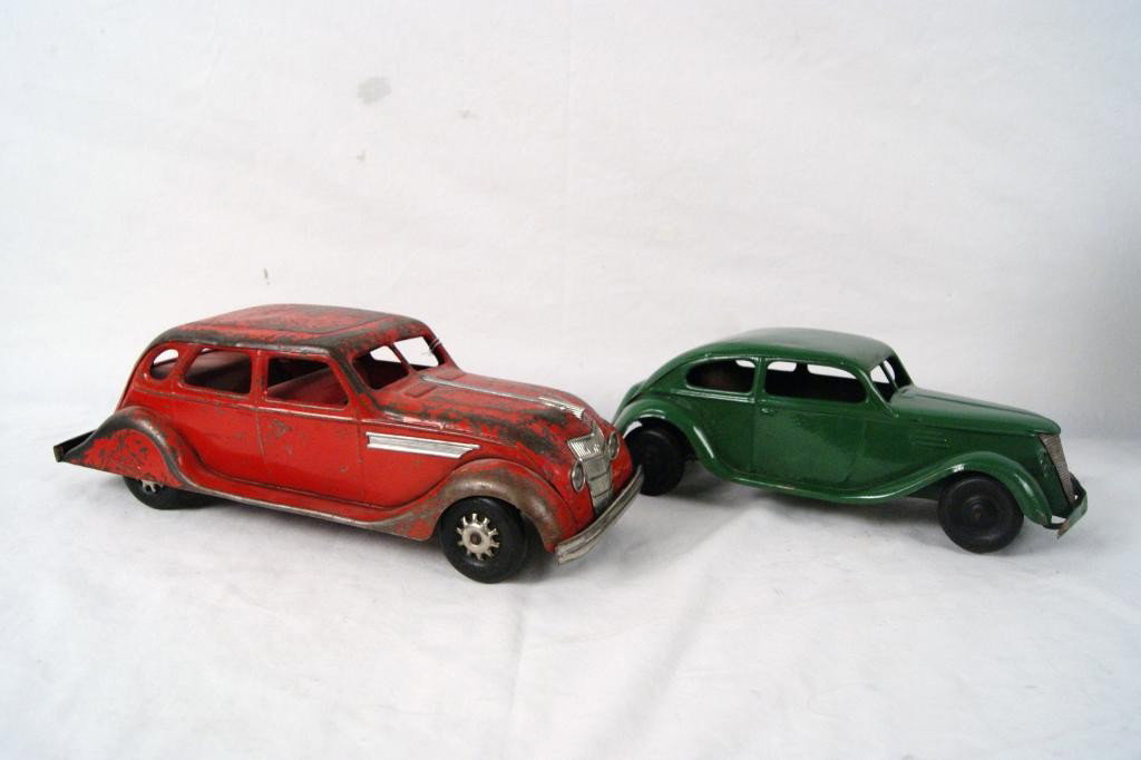 2 Vintage Kingsbury wind cars: Kingsbury Toys Four Door Windup Toy Car By Kingsbury Toys, Keene NH. Rubber Tires- 14" and Green Vintage Kingsbury windup at 12". Winds and wheels turn