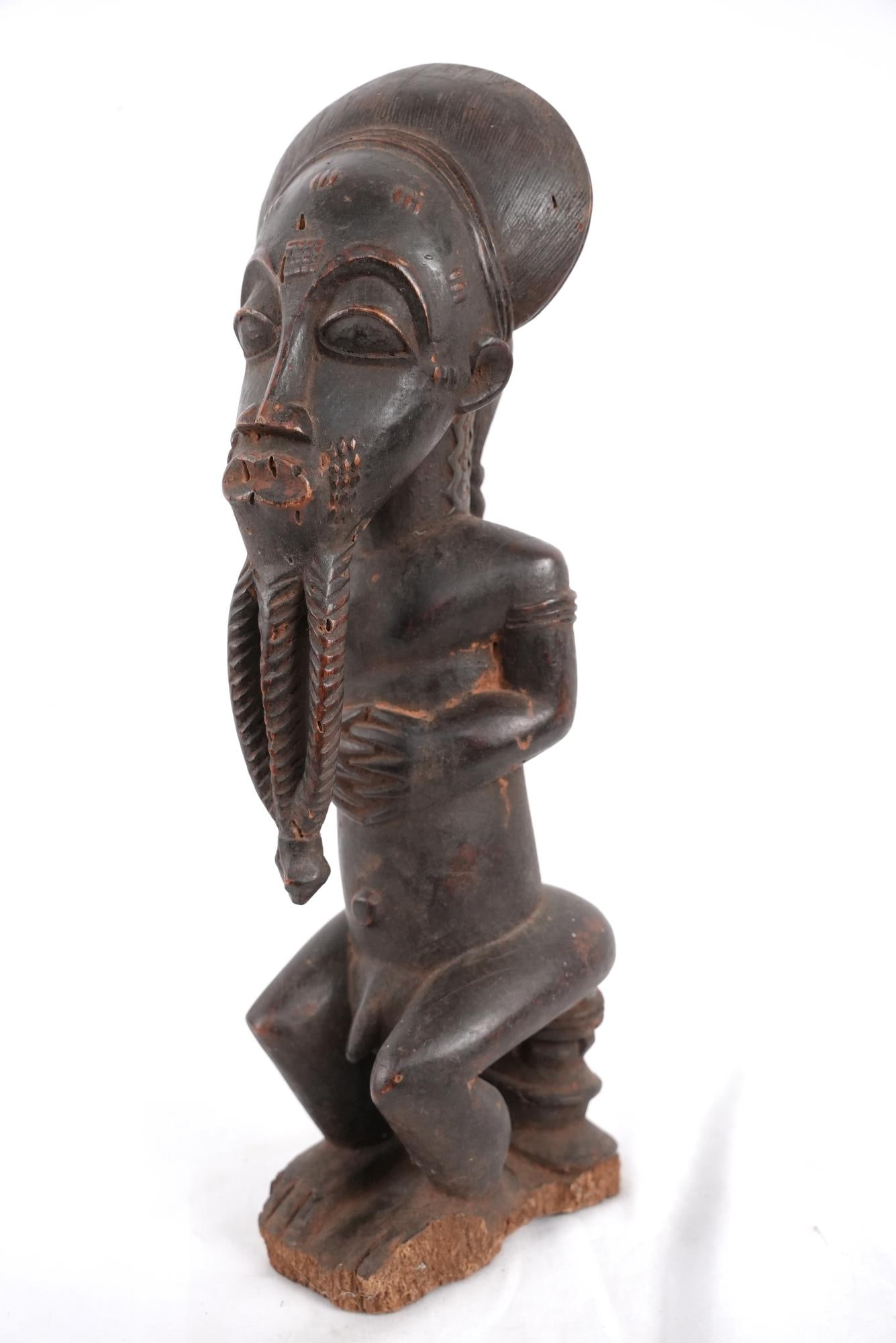Baule Ivory Coast Wood Carved male figure: authentic ancestral piece, shows age and use, long beard three part beard, wearing a cowled mask, measures 21 x 6.5" x 7" from a prominent west coach collection, provenance upon request