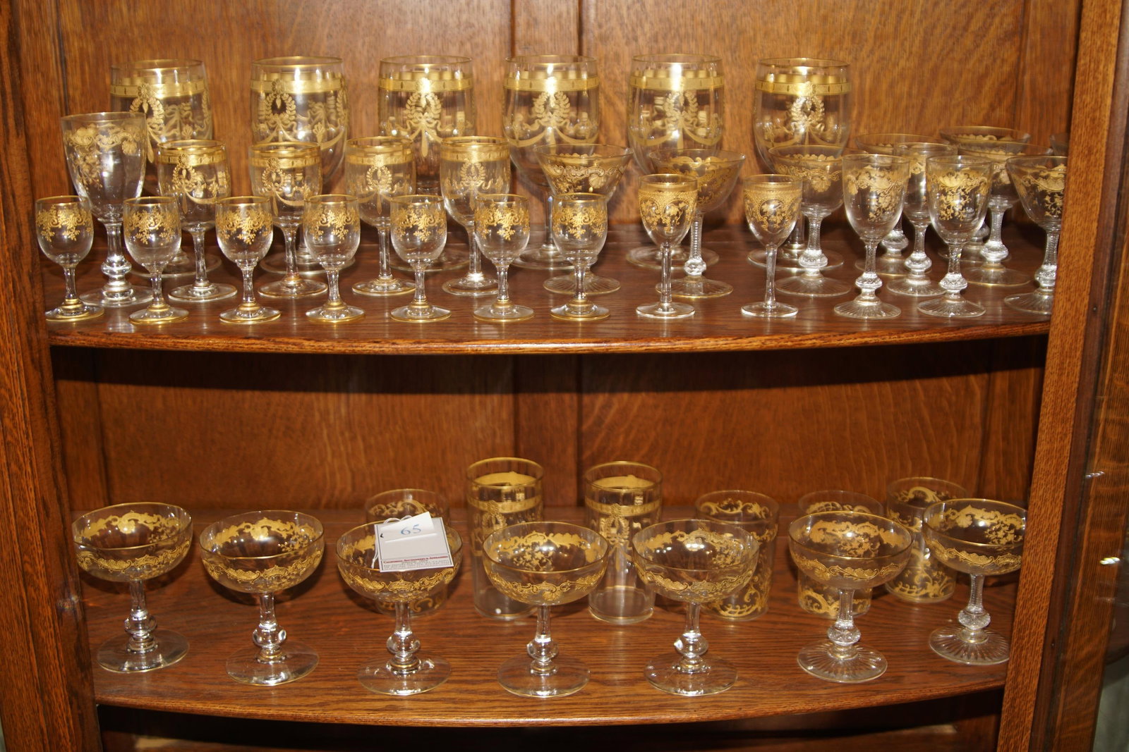 Collection of antique gold overlay stemware 50 pcs: Huge amphora shaped wine carafe, wine glasses, antique champagnes, waters, aperitif's and more approx. 50 pieces