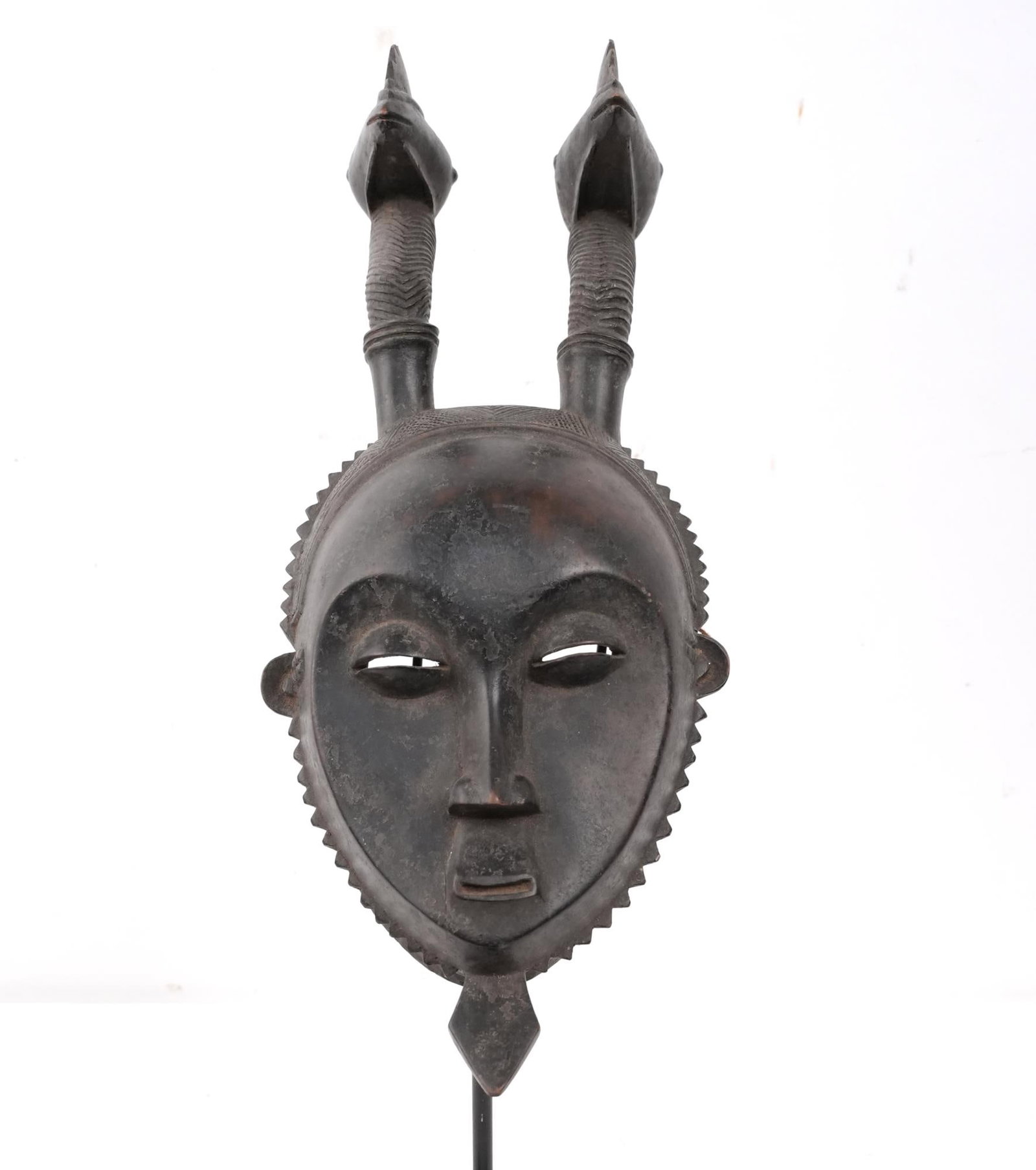 Baule/Yaure Ivory Coast wood carved mask w 2 birds: authentic dance mask with spade chin, sawtooth bezel, sculpted heart shaped face and two protruding long necked birds measures approx. 16.5" x 7" x4.5" Provenance: Noted Montecito, California African 
