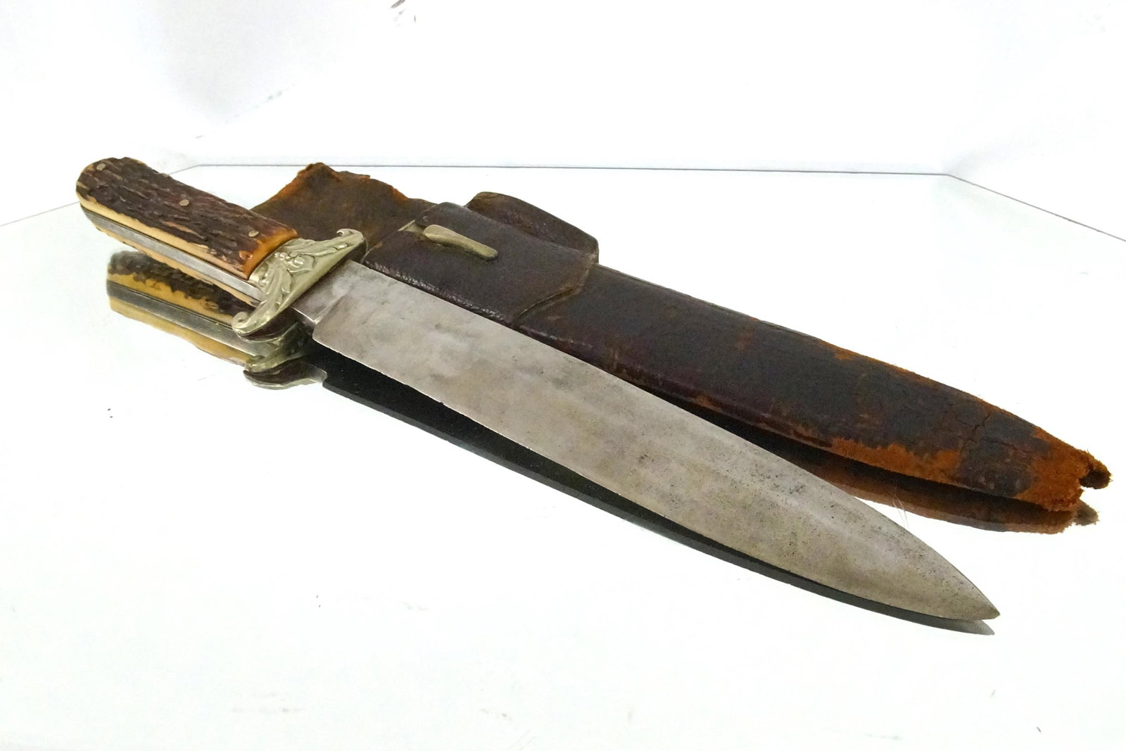 Unwin & Rodgers Period Bowie Knife: Marked NON * Unwin & Rodgers on the left near the spine original silver trim scabbard 8 .75" blade, 13.75" overall Silver guard, antler grip