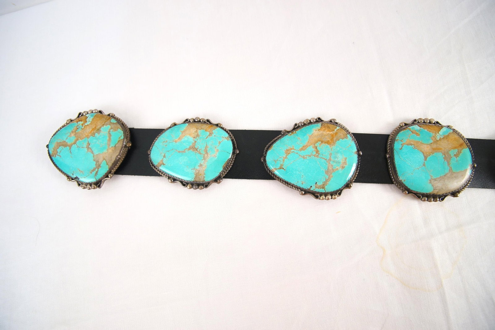 Vintage Navajo Kings Manassa Turquoise Concho belt: includes 9 conchos with Natural Manassa turquoise in the matrix measuring 2.5" - 3.5" each, Sterling setting belt measures 45" total