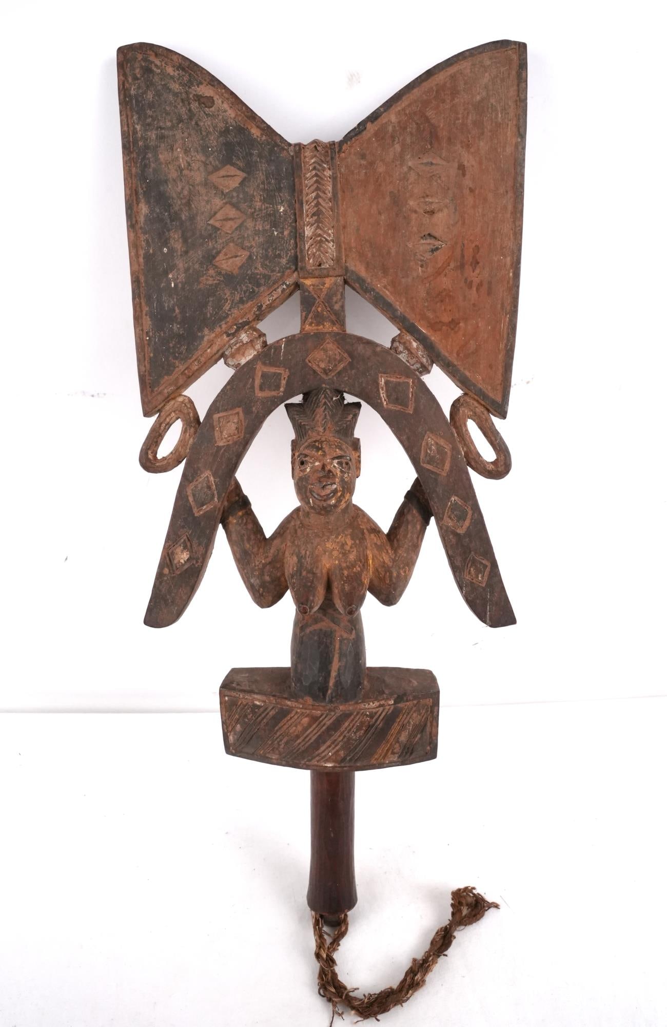 Yoruba, Nigeria Dance Stick of Ese: Very old, shows age and authentic use, polychrome paint is fading with remnants of black red and white pigments, original tassel measures 23" x 9.5" x 3.5" Provenance: Important Montecito estate Afric